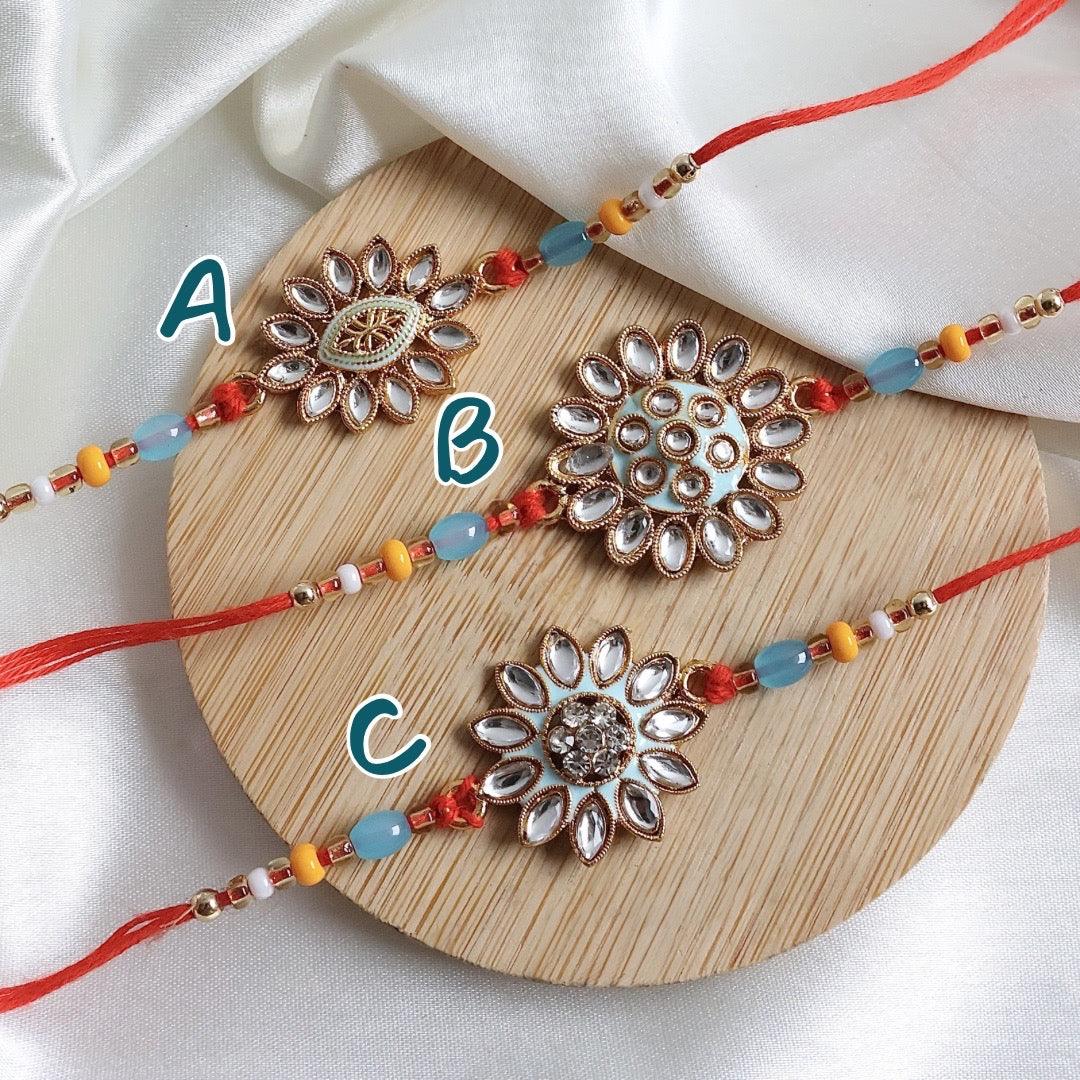 Enthralling Stone Rakhi Set with Tilak Combo