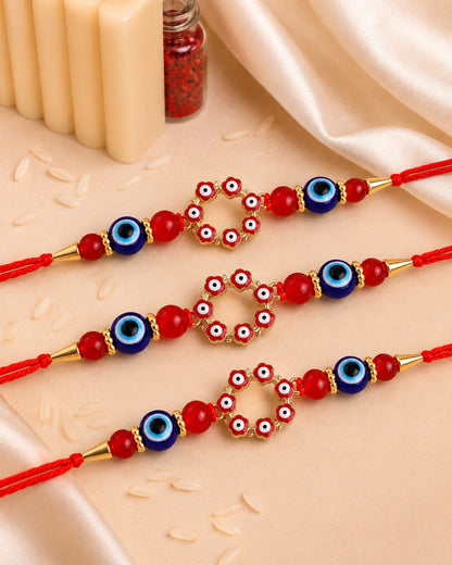 Pack of 3 Red Chakra Evil Eye Rakhi with Card | Tilak Set Included