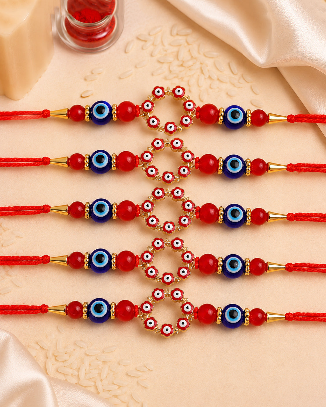 Pack of 5 Red Chakra Evil Eye Rakhi with Card | Tilak Set Included