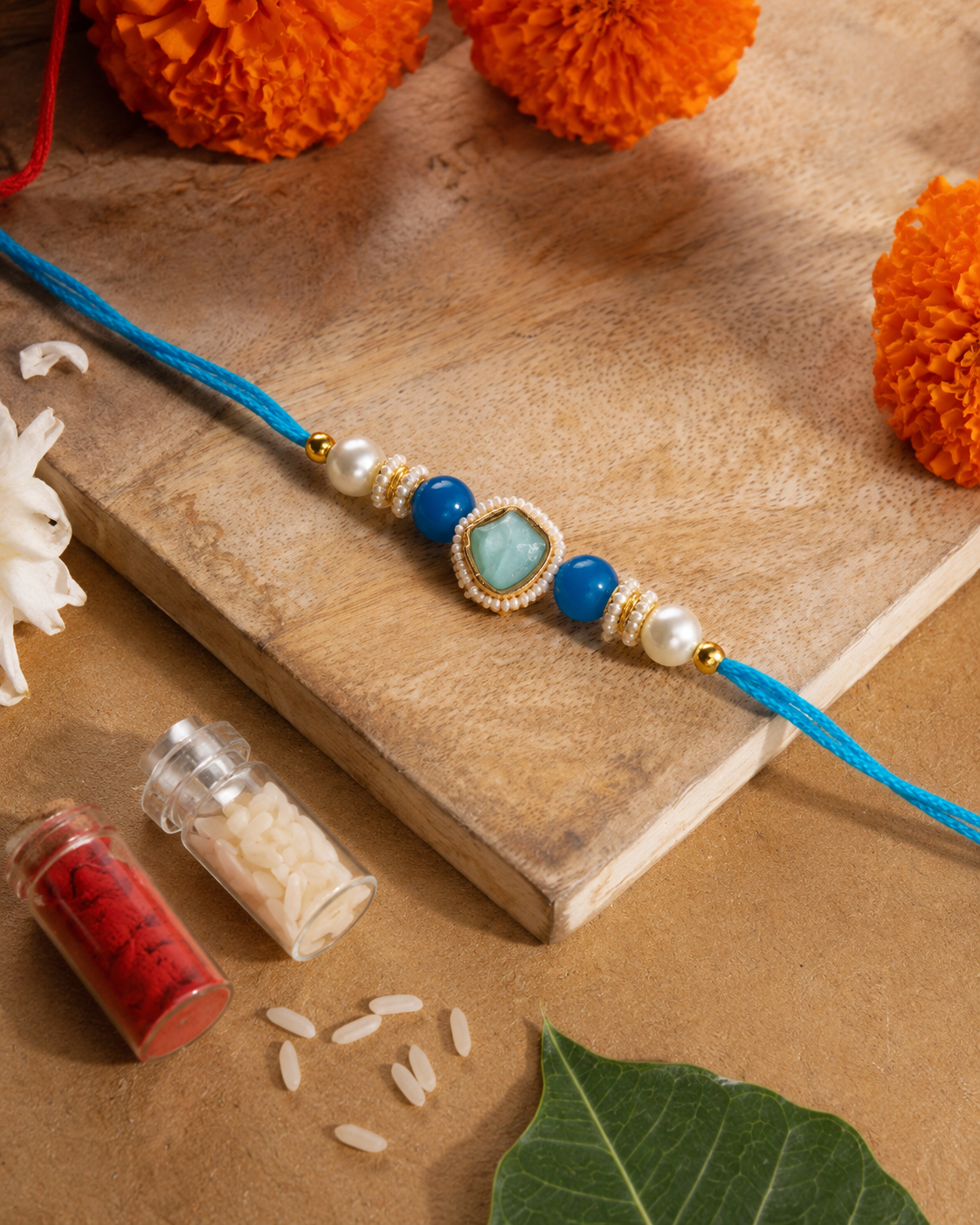 Turquoise Elanika Kundan Rakhi for Brother | Tilak Set Included