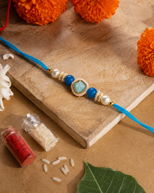 Turquoise Elanika Kundan Rakhi for Brother | Tilak Set Included