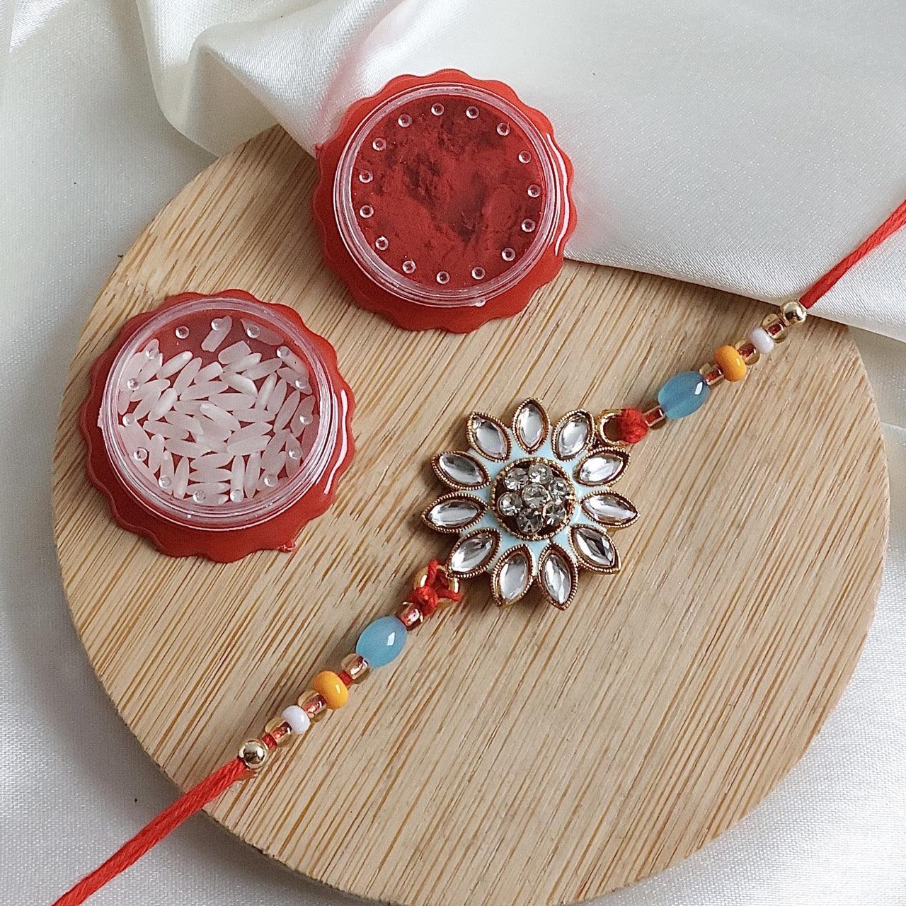 Enthralling Stone Rakhi Set with Tilak Combo