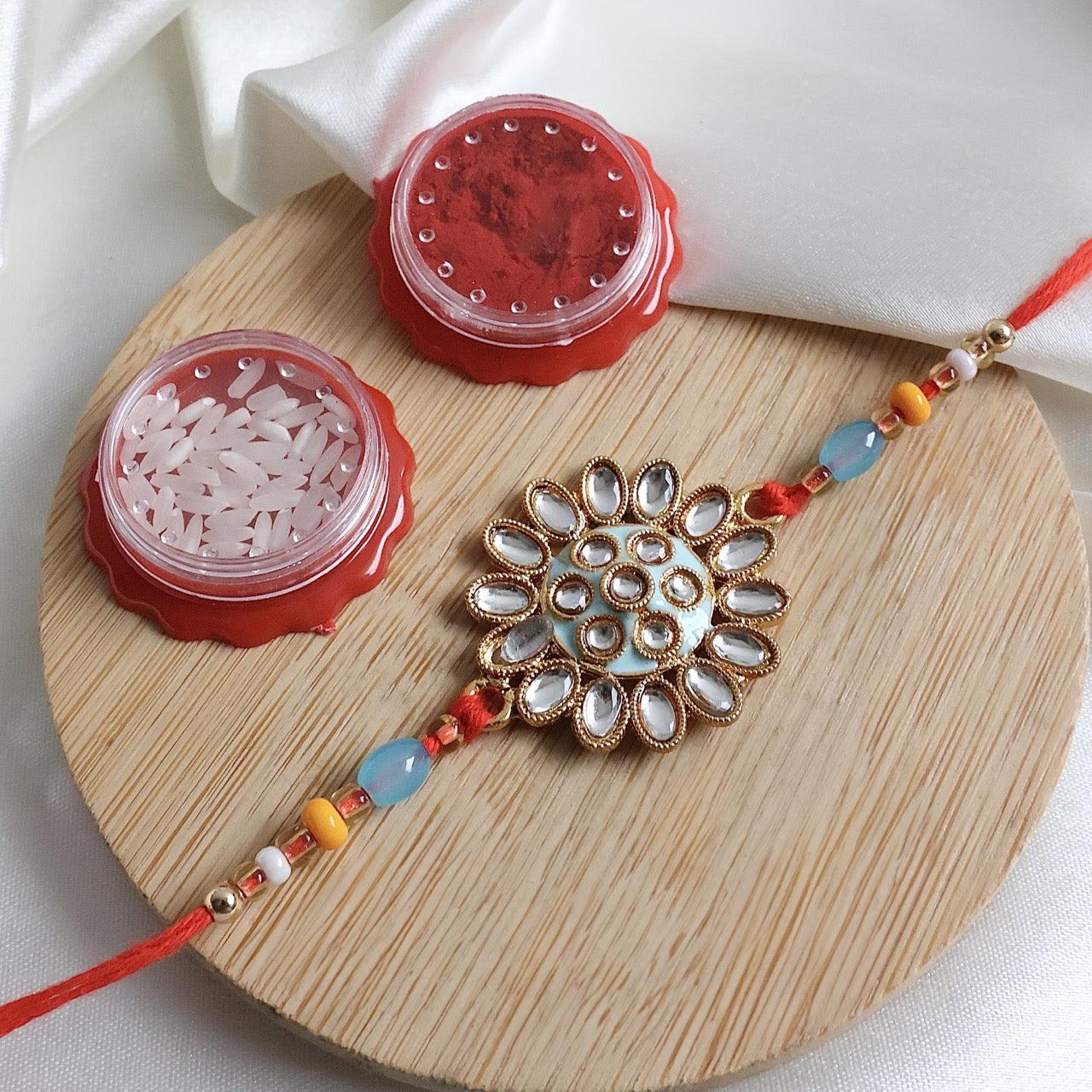 Enthralling Stone Rakhi Set with Tilak Combo